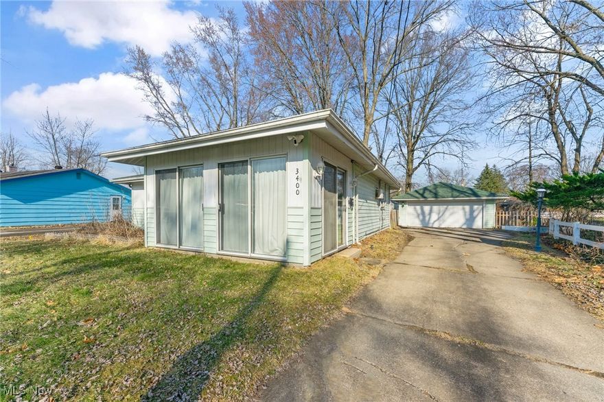 Come see this updated 3br 1 bath home in Warren.  Home features vinyl plank flooring throughout the kitchen, hallway, and bedrooms.  Living room and sun room has carpet.  Kitchen and bathroom were both updated in 2022.  Bathroom has a tiled flooring and shower, Kitchen has updated cabinets and tiled backsplash.  Roof was put on in 2020, HWT 2017, and the furnace is Carrier.  Nice sunroom with sliding glass doors on the front of the home. Large 2 car garage with opener.  Home has wall cooling unit but does have forced air heat with duct work already ran so adding a central air unit is possible.   Schedule your showing and make home ownership a possibility.