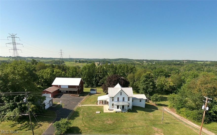 Location is everything, this freshly remodeled 4 bedroom Victorian style house sitting on almost 3 acres has all the work done for you.  Featuring all new flooring throughout, fresh paint, beautiful old wood trim, finished walk-in attic, large basement, and so much more.  This home offers a large 1st floor primary suit with a private deck and 1st floor laundry. You must see the beautiful woodwork and stained glass to appreciate this home.  Featuring also a 1 car garage under the house, 2 car heated shop and a barn with another 2 car garage and it all comes with free gas. This property offers many options, it can be your mini farm, business, or your country living close to town. The property was used for years as a small business out of the hand hew beam barn which has solid wood floors throughout. More land is available for lease if interested.