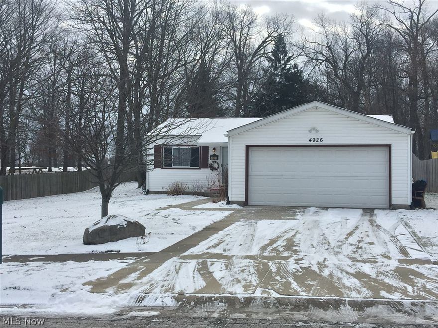 Darling ranch home in the heart of Perry Township! Brand new front door greets you as you step into the home. A lot of light opens up the main living area which flows from living room to dining room. A sliding door off of the dining room leads to the spacious backyard that lends a private feel. The two tier deck currently has a hot tub and steps down to a covered canopy which offers shade in the warmer months- sellers are willing to leave both at the home or remove them. The yard has updated landscaping, a fire pit and plenty of room to add a storage shed or recreational items.  Back inside the home the kitchen is open to the dining area. The kitchen offers a lot of storage options for its size, as well as new appliances purchased in 2016 which all stay with the home. Hardware and lighting has been updated throughout to offer a more updated look. The home has also been freshly painted in neutral hues along with the main living area carpeting being replaced in 2016 as well. The bathroom