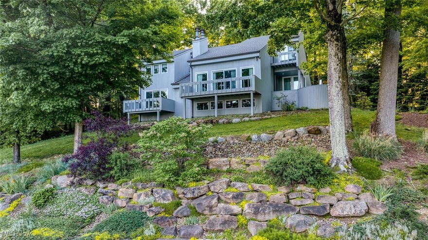 Situated on the hill on the prestigious Beechwood Island, on nearly 0.6 acres, this large contemporary home offers an exceptional blend of comfort, quality, and timeless charm. There are 4-bedrooms, 3.5-bath homes and features over 2,800 square feet of living space designed for both relaxation and easy entertaining. 

Step inside to find a bright, open interior accented by two cozy fireplaces and large picture windows that frame tranquil outdoor views. The living and dining room windows and doors were upgraded in 2014, flooding the home with natural light and enhancing its inviting atmosphere. The kitchen is tastefully updated with a modern layout, perfect for preparing meals with ease and style. Off the kitchen is a spacious laundry room with a unique stainless-steel sink and washboard.

The home's thoughtful upgrades continue with a new roof installed in 2018, a new water softener in 2021, and fresh interior and exterior painting completed in 2022—providing peace of mind and polished aesthetics throughout. The finished lower level offers flexible space for a brightly lit family room and a Rec room that is currently used as an office. 

Outdoors, mature trees and a gentle water view create a serene backdrop. The spacious backyard offers endless opportunities for gardening, relaxing, or gathering with friends. The rear patio is perfect for get togethers.  An attached heated and cooled two-car garage ensures ample storage and plenty of parking.

Twin Lakes beach amenities are available as well.