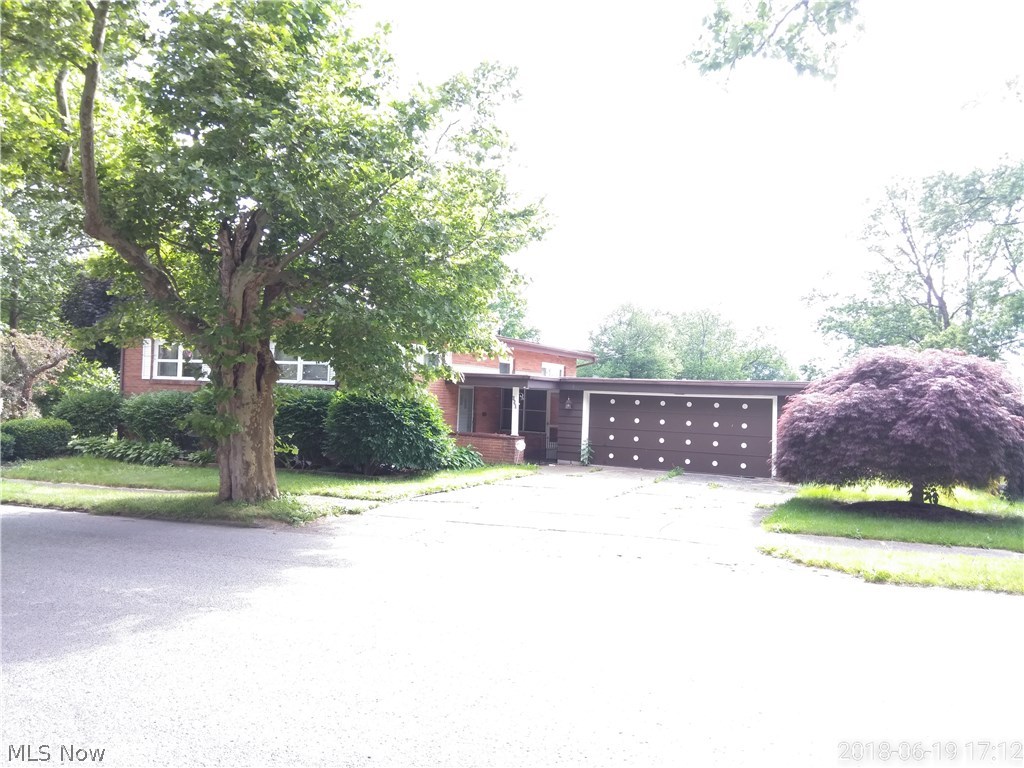 Custom built by the Original owner, well maintained California Style all Brick ranch with lots of character Open floor plan with rustic cabin feel. and central air. Beautifully landscaped with mature trees, and wide array of perennials and shrubbery. as Every room on the first floor offer cathedral ceilings with Cherry wood beams throughout . Beautiful hardwood floors in living room. Three way view Floor to ceiling Stone Fireplace that opens into the living room and kitchen and dining area is unique nestled in the stone is built in wall oven. An appliance eqipped kitchen with hardwood floors and eat in open space. concret front porch and side porch. This home offers so much storage, basement has (5) finished rooms that can be used as bedrooms, office Laundry room... Originally was a Physicians office and (Once was used as offices) Spacious Enclosed breezeway attaches to the 2 car garage. many updates include the Newer furnace, air and hot water tank. Newy installed dimentional sh
