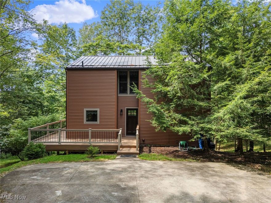 Move-in ready 2-bedroom, 2-bath home in the private, gated Lake Mohawk community. A perfect weekend retreat, this property features a bright kitchen with first-floor laundry, open living space with vaulted ceiling, (2023)gas fireplace, and a large composite deck (2023) overlooking a wooded lot with seasonal lake views. Major updates include low-maintenance replacement windows/doors, siding, gas furnace (2023) and a durable metal roof (2023) offering peace of mind. The upper level provides a bonus area full bath and a bedroom. The finished walkout lower level provides flexible living - ideal for a family room, guest space, or home office. Enjoy Lake Mohawk amenities including boating, fishing, swimming beaches, tennis, pickleball, clubhouse, and a manned 24/7 gate. Conveniently located near Canton, this home combines comfort, privacy, and resort-style living in one of Ohio's most desirable lake communities. Don't miss your chance to own a piece of the Lake Mohawk lifestyle!