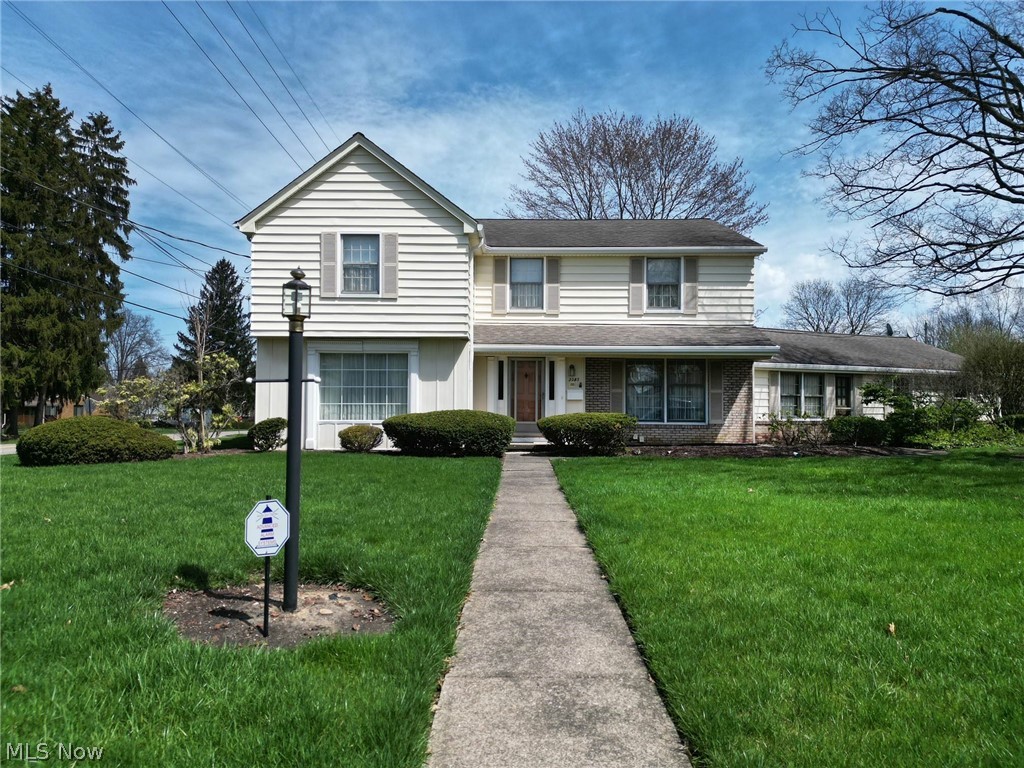 Quality built (plaster, hardwood), spacious home with lots of storage! In beautiful, move-in condition! Crown moldings in living room (fireplace is decorative) and dining room, family room with gas fire place and wet bar (wood under carpeting), huge kitchen with large pantries (extra refrigerator in second pantry), all appliances stay; 3 upstairs bedrooms have newly refinished hardwood floors. Many updates include: Upgraded electric (3/24); New 50 gallon HTW (3/24); two newer furnaces and A/C's, new sanitary sewer from home to street; vinyl siding power washed and new gutter guards in front of home. Interior also includes an enclosed heated breezeway (owner used as large office), full basement with laundry (washer/dryer stay), walk-in cedar closet, sump pump and lots of storage closets. Very private backyard with a brick patio and beautiful border of lilac bushes!. You'll love this home!