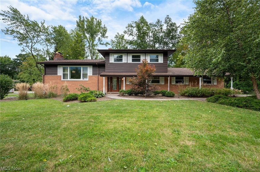 Welcome to this spacious, 5-bedroom, 3 full bathroom, split-level home In Solon, OH. Set back from the street with a curved driveway, you will immediately notice the beautiful landscaping and mature trees. Step inside and you are greeted by a very large foyer, passing through from front door to rear patio door, along with an abundance of storage. Down the hallway to the right is a full bath, first floor bedroom, space that can be an office or family mudroom, right next to the entrance of the two-car garage. Up a short flight of steps to the formal living room with large picture window and hardwood floors, a dining area overlooking the gorgeous backyard and an updated kitchen are sure to provide space and comfort. Also, off the foyer, stepping down, you will find a large family room with access to an additional outdoor patio, a full bathroom, a bedroom, laundry room with access to the back yard and steps leading to the basement. On the top floor you will find three large bedrooms with hardwood floors and a full bath. Home Warranty included. Don't miss out, call today!