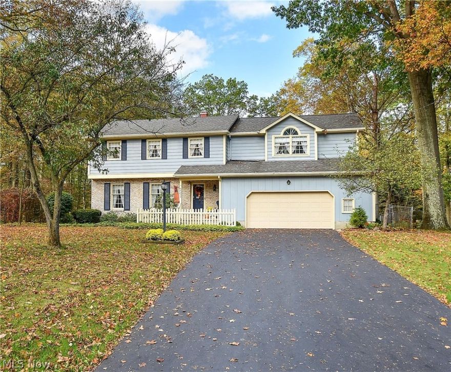 Classy in Canfield! This gorgeous 4 bedroom total with 2 Master Suites, 3.5 bath Colonial style home with 2,516 square feet- has it all!  The exterior boasts Pella Windows, brick and aluminum siding, newer Trane furnace and AC, 2013 40 gallon Hot water tank, sun room, 2 1/2 car garage, newer roof and gutter guards, 2010 Trane Furnace and 2013 AC. The interior features classic charm throughout.  The remodeled kitchen (2008) has cherry cabinets, stainless appliances, quartz counters, stainless under mount sink, and ceramic tile flooring.  This home has flexibility with the 2 master suites - 1 would be a wonderful mother-in-law area with its own private bath. The massive Master Bedroom and Bathroom addition (1991) measures 26' by 15' with vaulted ceiling, window seat, circle top window, enormous walk in closet (12' x 10') and equally large Master bath with stand up shower, recessed lighting, skylight, dual sinks and Jacuzzi tub. The second Master Bedroom also has a large walk in closet an