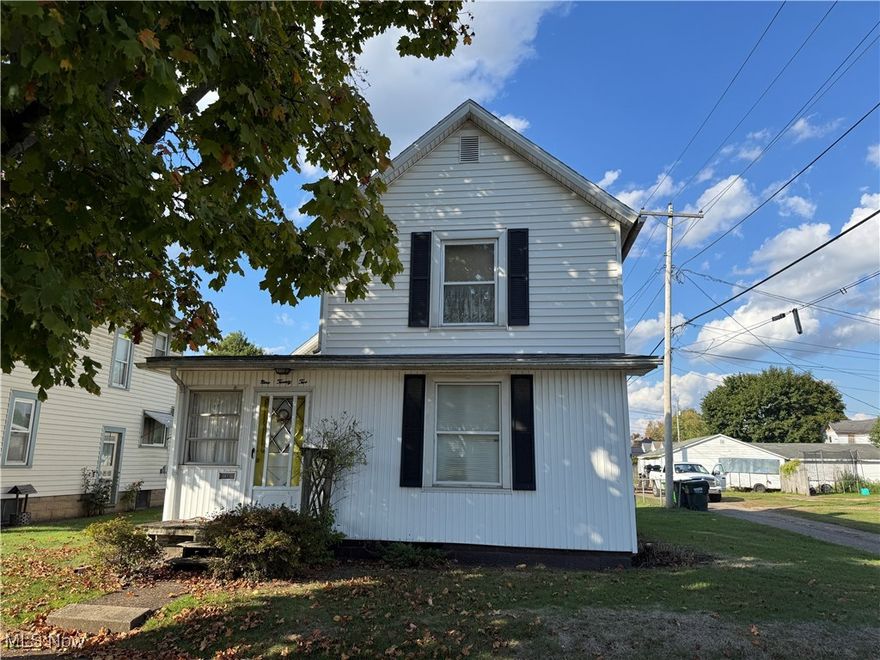 ONLINE AUCTION, the RESERVE (Minimum Bid) is $30,000. The auction ends at 7:00 PM, Thursday, November 13th, 2025. BUYERS MUST SIGN ACKNOWLEDGEMENT OF TERMS to bid. Agents, please see 'A2A'. This property includes a two-story, two-bedroom, 1.5-bath home built in 1910 on a 0.19-acre lot with a detached two-car garage and full basement. The home is connected to public water and sewer and features forced-air heat and central air. Documented work includes a Termite Bait Sentricon corrective treatment completed in 2025, a roof replacement on the main house and front porch in 2016, bathroom tear-out and remodel with new flooring and tile in 2016, replacement of the sewer main to the curb in 2018, and a new hot water tank installed in 2021. Located on a corner lot, the home offers additional yard space and multiple access points to the property. The property is approximately two miles from downtown Coshocton and will be sold as-is with immediate possession at transfer.