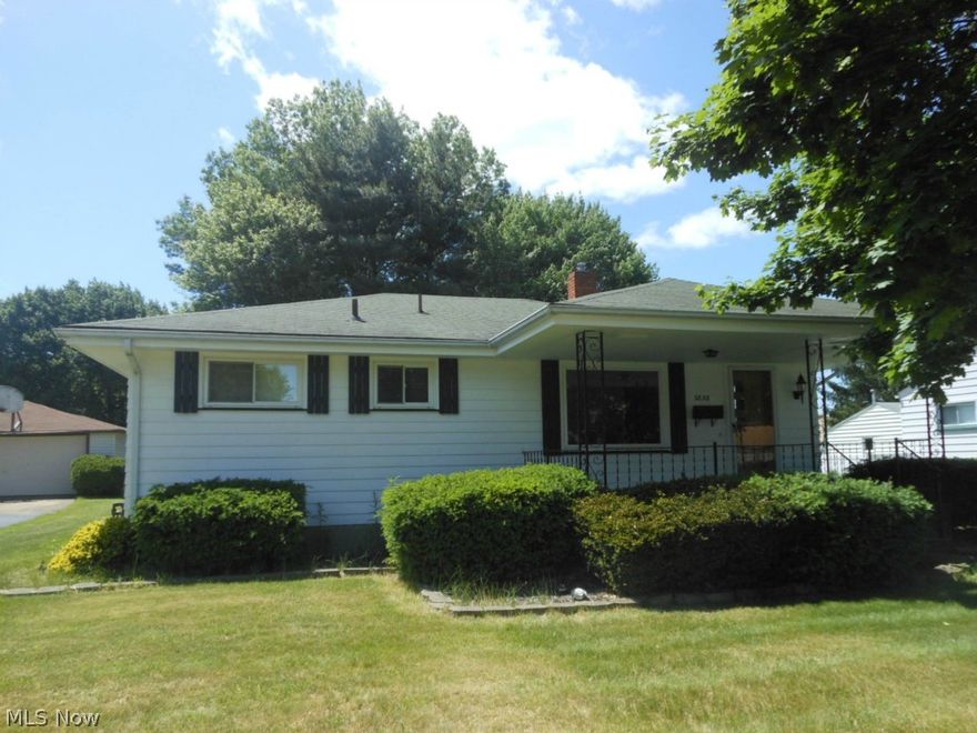 CANFIELD SCHOOLS!  Amazing 6 car garage (2 car attached and 4 car detached); perfect for a workshop, a collector, or  the car enthusiast. Freshly painted inside and out, this 2-3 bedroom home with newly refinished hardwood floors in the living room, bedrooms, and formal dining room (Buyer could easily convert this room back to the 3rd bedroom since it has a closet or use it for an office) offers an eat-in kitchen and sunken family room with brand new carpet.  2 full bathrooms too! The wonderful covered front porch is a great place to relax on those hot summer days. Vinyl replacement windows through out. Washer and dryer included! Full basement. Central air.  All of this located on a street with sidewalks and a nice big shade tree out front! Call today to make this house YOUR HOME!