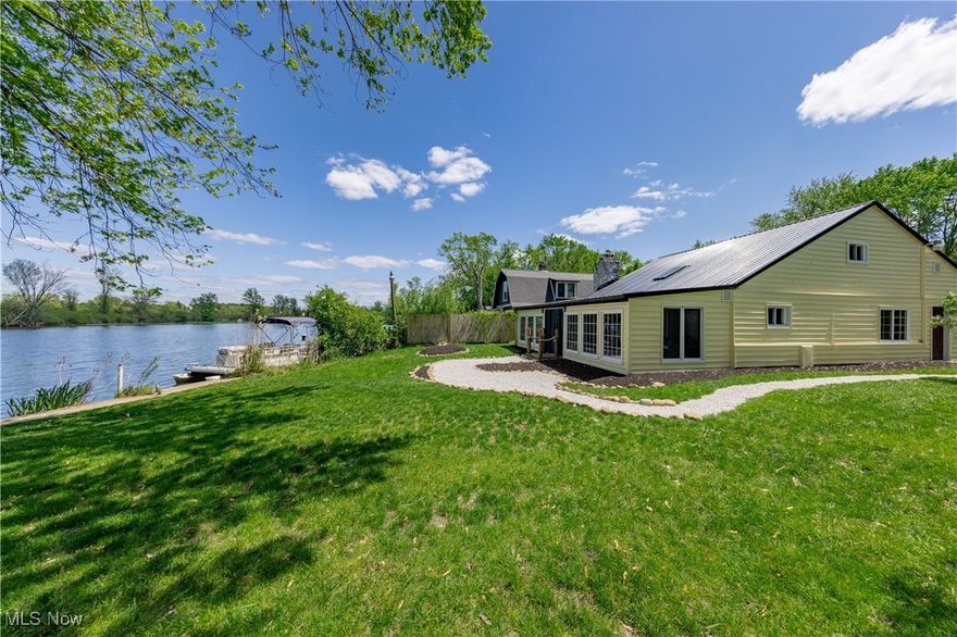 Welcome to this beautifully reimagined Cape Cod retreat, perfectly positioned on the shores of Long Lakes—just in time for summer! Behind the gates lies your own private escape, where every detail has been thoughtfully updated to enhance comfort and capture the serenity of lakefront living. Step inside to a charming sitting room with stunning lake views, leading into an open-concept great room and modern kitchen featuring stainless steel appliances. A versatile office space also offers breathtaking lake vistas, making work-from-home feel like a getaway. The first floor also includes a spacious laundry/mudroom, flexible family room, and a tranquil primary suite with an updated en-suite bath—plus another full bath and additional flex room. Upstairs, two cozy bedrooms and a full bath provide extra space for guests or family. Outside, relax in the gazebo, gather around the firepit, or cast a line in one of Portage Lakes’ best fishing spots. Improvements include but are not limited to: new metal roof (2022), new siding (2022) new flooring throughout (2023) , new windows in kitchen, staircase, lakefront rooms and upstairs bedroom (2025), minisplit heating and cooling (2024)
Whether you’re looking for a year-round residence or seasonal sanctuary, this lakefront gem is your chance to live like every day is a vacation!