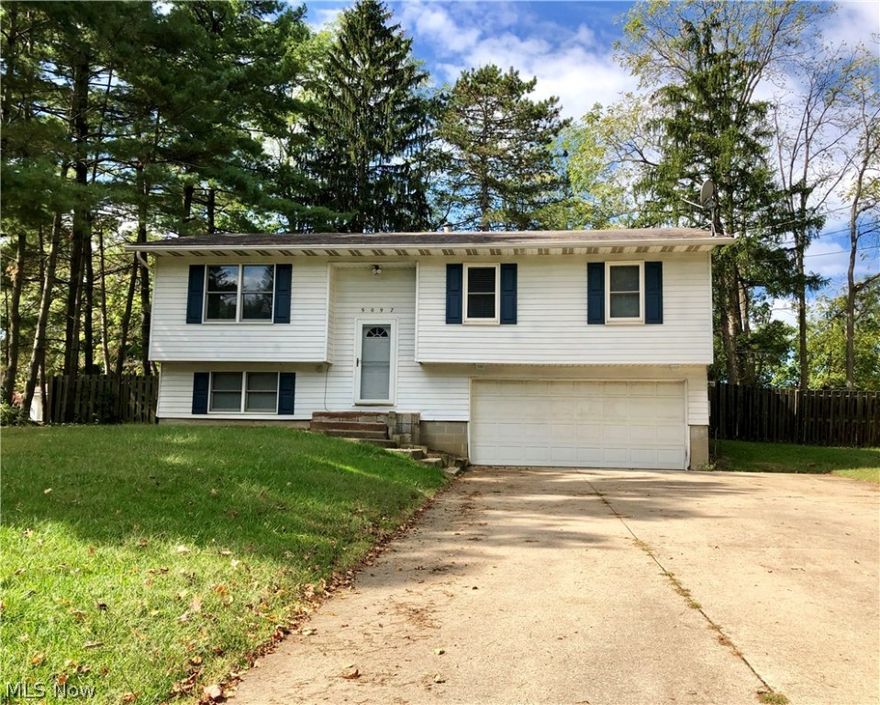 Absolutely lovely bi-level home in the heart of Streetsboro. Right down the street from the Streetsboro Elementary and Middle Schools. Close proximity to shopping, dining, parks, playgrounds, hiking trails and much more. Many new updates throughout the house. Most notably upstairs is the new kitchen completed with granite countertops, new appliances, cabinets, and under mount sink. New pergo lifeproof vinyl flooring has been in stalled throughout living room, kitchen, and hall. Three good sized bedrooms all with ceiling fans and a half bathroom off the master suite. The lower level has a huge bonus room, utility room and walks out to two car garage. Sliding glass door from dining room leads you out to porch and spacious backyard. Air conditioner replaced in 2016. Hot water tank replaced in 2014. Lovely home. Schedule your showing today!!