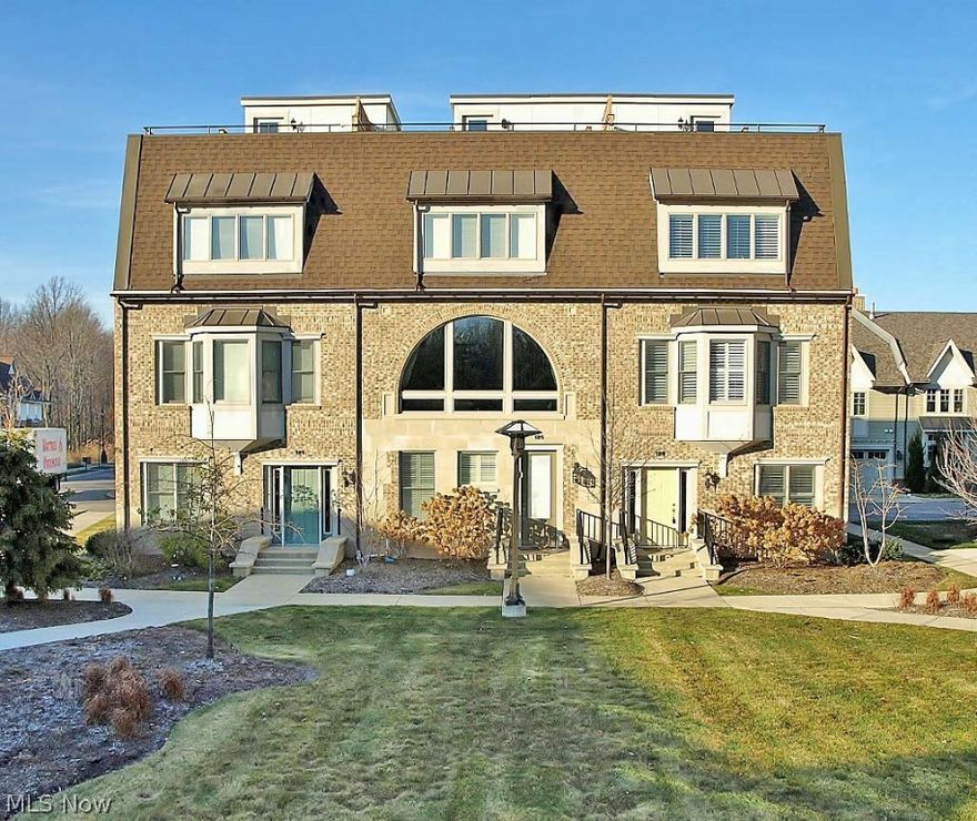 Why build? Better than new urban chic row home located in the heart of Crocker Park.This super hip space offers living at its finest.4 full finished floors include full finished lower level w/ full bath.Main floor ideal for family room or office.Awesome windows throughout unit makes this bright,open and airy.Bamboo hardwood floors,solid core white paneled doors and kitchen. State of the art Electrolux stainless appliances in kitchen.Upgraded lighting package throughout. Master and second bedroom on third level w/ upgraded bathrooms and flooring.Roof top deck ideal for entertaining and relaxing.Walking distance to all your favorite shops and Starbucks. Truly a gem!