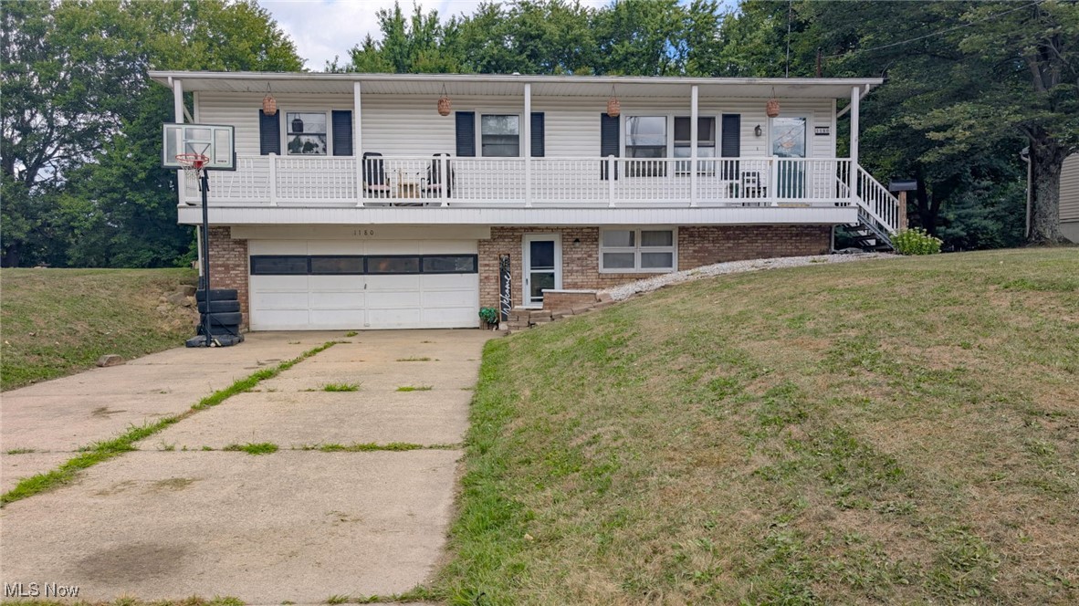 Welcome to 1180 Jones Drive! Enjoy the simplicity of single level living while being tucked away in a quiet neighborhood! From the minute you pull into the driveway you will notice the charming full length covered front porch! Step inside where you're greeted with open concept living with the living room leading right into the eat in kitchen! Off of the kitchen glass doors lead out to the deck and back yard space, perfect for relaxing or entertaining. Off of the living room you will find 3 bedrooms, a full bathroom, and the convenience of first floor laundry! Enjoy more living space in the partially finished walk out basement that also has a full bathroom! Updates include new furnace and A/C 2024, new dishwasher 2025, and new hot water tank 2023! Call to schedule your showing today!
