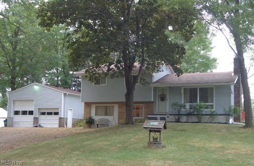 Well-maintained doll house in Green school district. 3 BR's, 2 baths. 2 fireplaces. Hardwood floors under carpet in bedrooms, hall and living room. Basement. Private lot with mature trees. Kitchen appliances stay. 24X24 detached garage with 12 ft. ceilings, 10X10 garage door and a standard garage door. 14X17 deck. Kinetico water softener. Seller offering a 1-year America's Preferred Home Warranty.