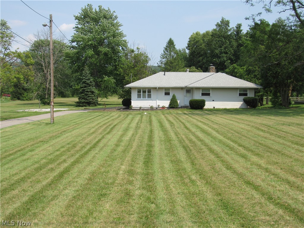 Be first or be sorry! Immediate possession! Long time owner lived here. Three bedroom, one bathroom Ranch with three car garage on 5 beautiful acres of land! Eat-in kitchen and formal dining room. Stone, gas log fireplace in living room. Formal dining room and family room have ceiling fans. Owner bedroom has his & her closet. Three season sun room. Full basement has finished recreation room, laundry room, mechanical area, workshop, canning room and glass block windows. House sits far off the street. 200 x 1089 beautiful yard! Beautiful land views from the rear of the property. Country living in the city! Pull down steps to the attic. Garage has huge storage above. Two out buildings. roof approximately 5 years old. Two new garage door openers. Newer water pump. Vinyl windows. City water at street if needed. Highland School District, new grade school coming! Includes one year Cinch Home Warranty!