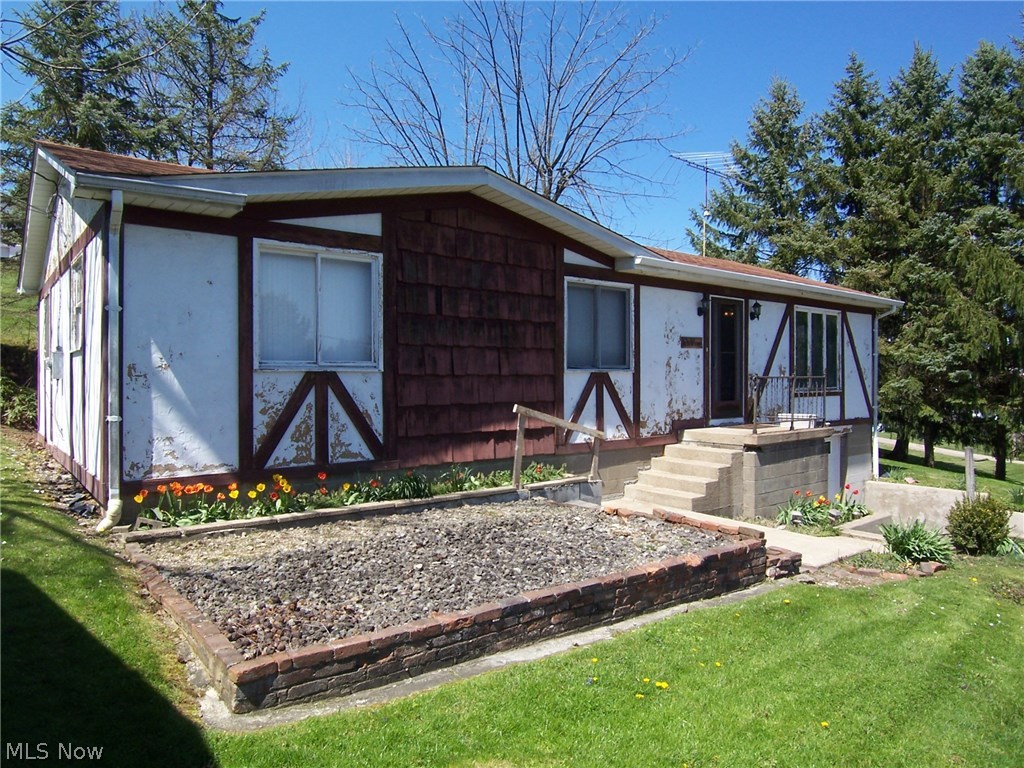 Wonderful home with many unique features. Sauna area, office, cedar bonus room and large laundry room in lower level. One car garage in basement plus carport. Nice rear patio/deck area. Exterior is currently being scraped and painted. Window AC cools entire home and will stay. Needs a little cosmetic TLC to update this home but otherwise in good condition.