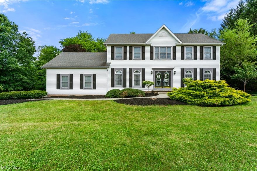 Beautiful Canfield Two Story.  The main level of this home plays host to an eat in kitchen with granite counters and newer appliances, a formal dining room, a large family room with fireplace, a living room, a sun room, a welcoming foyer, a laundry room, and a half bath.  A sprawling master with en suite bath and walk in closet, as well as, three additional bedrooms and a full bath comprise the second level.  Second level features also include newer flooring, paint, and spacious closets.  The full basement provides ample storage and a recreation room.  Exterior features include a two car attached garage, rear deck, and front stoop all on a scenic and freshly landscaped lot with a flowing stream at the back of the property.  Tons of space.  Call today!!