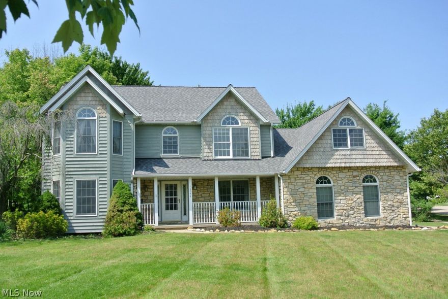 Nice 4/5 bedroom Colonial in North Royalton, but in the Brecksville/Broadview Hts School System. Former model home, with stone & cedar front elevation. Very spacious custom Kitchen w/ Corian countertops, vaulted eat-in area, hardwood floor, & brand-new SS range & microwave. Vaulted Master Bedroom & Bath w/ access, by walkway, to vaulted 2nd Bedroom/Den/Nursery. 5th Bedroom is large, vaulted Bonus Room. Family Room features stone fireplace & wet bar. 2-car attached Garage & 1 car detached Garage. New roof - 8/2011. Jacuzzi tub in MB. 15'x12' Storage Shed/Garage w/ concrete floor & attic storage. Small finished Rec area. 1-year Home Warranty!