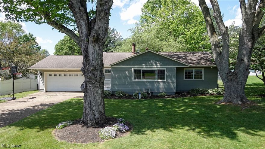 Charming 3-bedroom, 2-bathroom retreat nestled in the Field LSD, within the Brimfield Lake community.  Beautifully remodeled kitchen is the heart of the home, featuring new countertops, appliances, and a sleek peninsula for seating which seamlessly flows into the living room. The main floor boasts three bedrooms and an updated bath. New carpeting extends from the living room through the bedrooms. The dining room opens onto a large deck with a gazebo, which steps down to a fire pit. Enjoy the almost 1/2 acre fully fenced backyard. The basement presents endless possibilities, with potential for a separate living area. Complete with a second kitchen, laundry room, spacious rec room, full bath, and an additional room to suit your needs.
This home has been meticulously maintained and updated, with significant upgrades including kitchen remodel and appliances in 2019, window replacements, siding, roof, and garage door addition in 2011, central air installation in 2015, and a new furnace and well pump with oxidation tank in 2019. Homeowners in neighborhood have option to join the Brimfield Lake Association which allows year round access to the private lake, park and usage of the shelter!