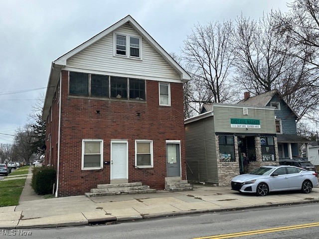 4-unit investor special! 2 buildings, one building on George St has 3 apartments, and the second building is the storefront. Total rents would be approximately $3000/mo fully-rented, professional management in place. Sturdy brick construction with newer roofs and vinyl siding, plus many updates such as: newer furnaces (one unit is heated by a boiler), storefront has central AC, upgraded electric panels, newer hot water tanks, separately-metered gas and electric, plus a 1-car garage. Great location near shopping, schools, freeway access and more! Just a little work to get this building up and running again.