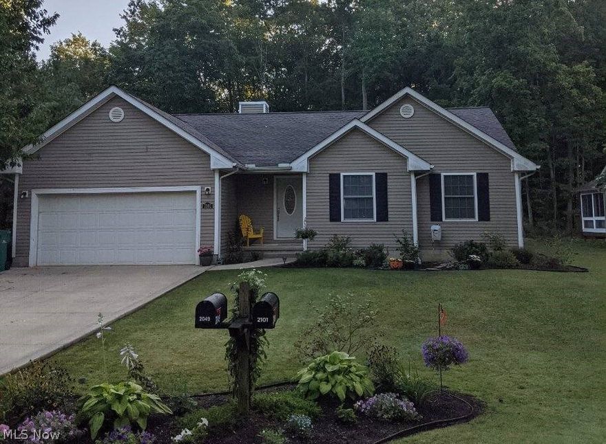 Just in time for the holidays!!! Do not miss this 3 bedroom, 2 full bath, energy efficient home with a 2 car attached garage situated on a beautifully landscaped lot in the private lake community of Roaming Shores! Many updates have been made to the home recently including concrete driveway, garage door opener, appliances, HVAC, hot water heater and stunning Porcelain flooring throughout. Generous master with walk in closet and full bath with soaking tub and shower. Main bath freshly remodeled with subway tile shower. Enjoy your gatherings on the freshly painted rear deck that opens up to the park like deep and wooded back yard complete with a beautiful fire pit! Brand new Amish built 12x16 shed which includes electricity, siding and metal roof upgrades for usability, durability and esthetics! Gravel drive on North side of house is perfect for boat or jet ski storage. For the avid fisherman, Lake Roaming Rock has several no-wake zones and ranks in the top five in Ohio for bass fishing.