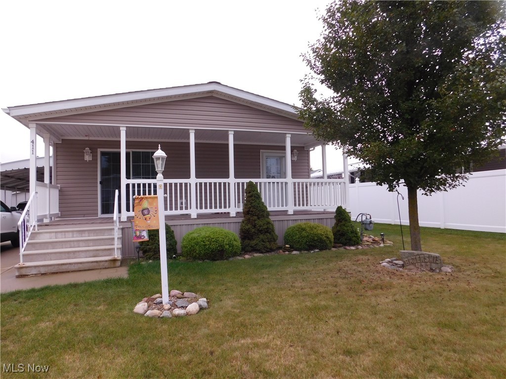 This beautifully maintained double wide ranch-style mobile home is located in the sought-after Twin Lakes 55+ Gated Community. Offering three bedrms and two full bathrms, with a vibrant and active lifestyle. Built in 2016, the Mansion Walnut model is situated on a desirable street. The attached carport and extra-wide cement driveway provide ample parking for two or more vehicles. Additional storage in the shed perfect for your extra belongings. The home is exceptionally clean and move-in ready. Step inside to a comfortable living space with numerous upgrades throughout. Every room features elegant crown molding, and the open-concept kitchen and dining area boasts beautiful cabinets, an upgraded backsplash, a large breakfast island with under-counter accent lighting, modern light fixtures, and durable LVT flooring creating the perfect space for casual meals or entertaining guests. All major appliances are included: stove, refrigerator, dishwasher, disposal, and microwave. The master suite offers a private bathroom with a double vanity, a large custom walk-in shower, a private commode and a generously sized walk-in closet. The two additional bedrms provide excellent closet space, with one featuring sliding doors to the covered porch. The laundry rm equipped with gas or electric dryer hook-ups, offers storage and a custom-built cabinet with a utility sink and folding area. Dryer included. A new roof installed in April 2023. The soft color palette, custom blinds throughout. Custom low-rise side steps with dual access points at the entrance. The community features beautiful ponds, pickleball courts, a fitness center, clubhouse, and even a dedicated dog park. Twin Lakes offers a vibrant social life, bingo nights, fishing, book club, potluck dinners, holiday celebrations. Whether you choose to make Twin Lakes your year-round residence or spend the winter months elsewhere as a snowbird, you will appreciate the active and engaging lifestyle here.