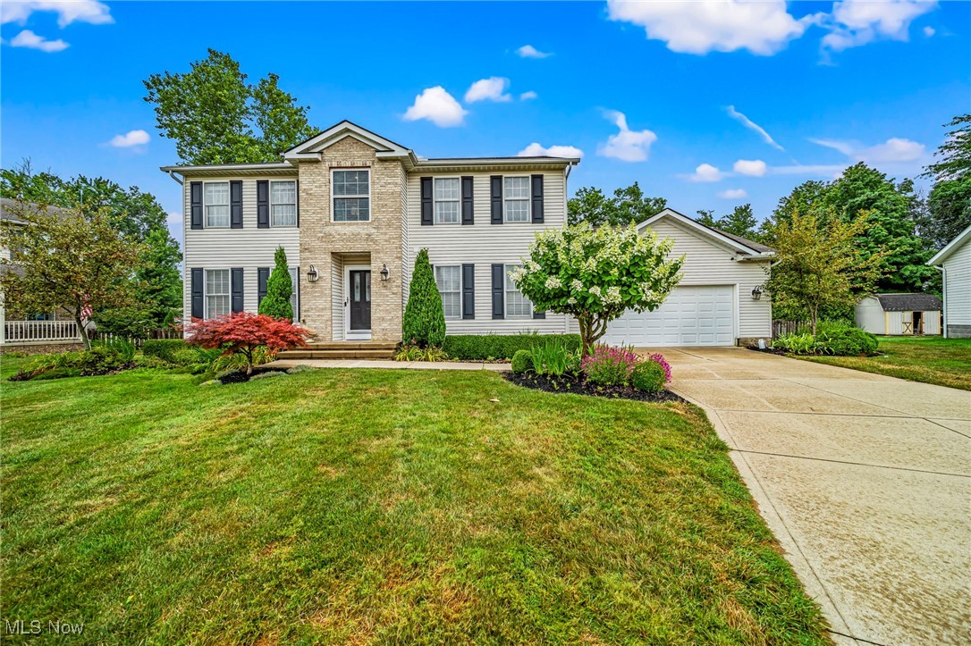Welcome to this spacious colonial in the very desirable Inland Shores community of Mentor. Located on a quiet cul-de-sac, you'll appreciate the safety this home provides, yet just a few minute drive from multiple shopping options. As you walk through this home you will feel the comfort of its wide open spaces. Features include attractive hard wood flooring throughout much of the main floor, a large family room with gas fireplace that flows seamlessly into the kitchen, a separate formal dining room, and an additional living room that can be used however you choose. A half bathroom is conveniently located just past the laundry room and entrance from the oversized, heated two-car garage. Upstairs are 4 generously sized bedrooms, including a spacious master suite with walk-in closet and huge master bathroom with dual vanities, garden tub, separate shower, and private water closet. The 2nd floor also includes an additional full bathroom. A full and pristine unfinished basement offers plenty of storage or options for finishing. Outdoors, the backyard is fully fenced in and features a beautiful composite deck leading down to a paver patio - perfect for entertaining or just relaxing. The charming shed also provides additional outdoor storage. Settle your family into this perfect home before summer is over!