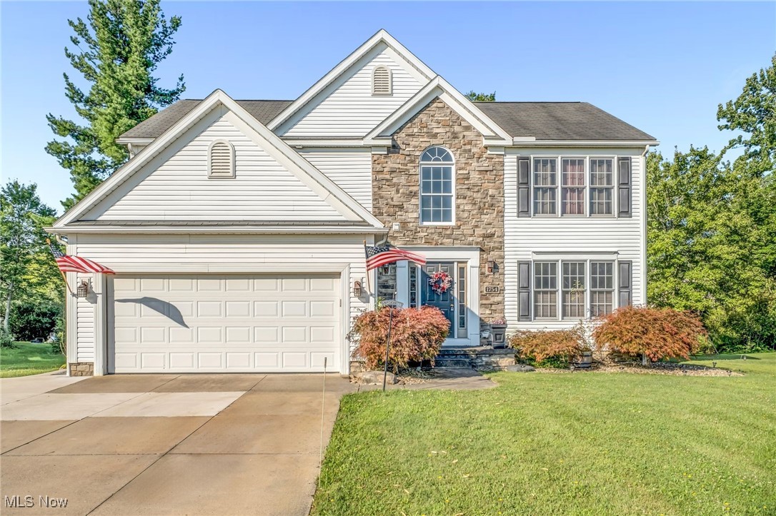 Welcome to 1754 Dunlap Dr in Streetsboro, a stunning 4-bedroom, 3-bathroom home that blends elegance, comfort, and functionality. Boasting ample curb appeal, this residence invites you in with a grand staircase and a warm, charming interior. The formal living room flows into a formal dining room, perfect for entertaining. The spacious kitchen features abundant cabinetry, stainless steel appliances, a breakfast bar, casual dining area, and new granite counters (2022), complemented by matching granite in the half bath. The family room offers cozy carpet and a fireplace for relaxed evenings. Upstairs, you will find spacious bedrooms with nice sized closets and the convenience of a second floor laundry room. The master suite is fully equipped with dual sinks and a large soaking tub, the perfect oasis after a long day. The finished basement provides extra living space, while the back patio creates seamless indoor-outdoor living. Recent updates include new central air and furnace (2022), hot water tank (2020), and a driveway extension for added parking. This home is move-in ready and perfectly situated near schools, parks, and shopping. Don't miss out on this opportunity and schedule your private showing today!