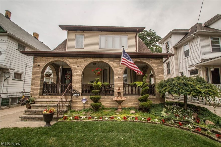 Amazing curb appeal w/ beautiful grand arches covering the large front & back porches w/ pristine landscaping, gorgeous flower beds, & perfectly manicured lawn. So much history to enjoy living in this 4 bedroom 3 full & 2 half bath Colonial w/ 1924 sq ft of living space. This beautiful home is located in one of Cleveland's original neighborhoods built in 1912, rich w/ architectural beauty & charm from newer dimension shingle roof to the original woodwork & custom arches throughout the home. Living room has wall of windows & gleaming hardwood floors & finishes add to its beauty & elegance. Formal dining room w/ wood built-ins w/ window seat & drawers underneath for storage. Kitchen has abundance or wood cabinets, center island & brick wall that adds warmth & charm along w/ an eating space. Family room w/ beamed ceiling, beautiful large stone full wall fireplace w/ a window on each side. 4 bedrooms & two full baths on the second level are comfortable & bright. Master bedroom has en-suite
