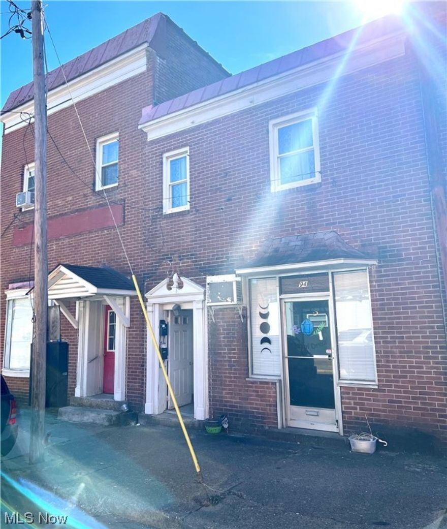 ATTENTION INVESTORS!  4 unit brick building that includes a retail space,  2-2 bedroom and 1- 1 bedroom apartments for a great investment opportunity.  Located in Wellsburg and within minutes to all conveniences