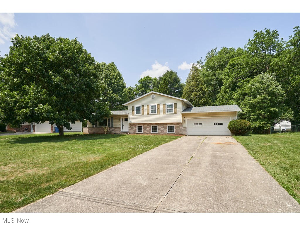 Wonderful 4 level split remodeled! Call to see this fabulous home on a culdesac with many updates. This home has vaulted /beam ceiling in the Great Room. New kitchen with white cabinets and oversized island. The island is 66 x60 with leather granite and great sitting area. The hardwood floors have been refinished in the Great room, Dining and Kitchen. There are newer stainless steel appliance and a commercial range hood. The Swing bath from Master completely remodeled with tub surround, cabinet and tiled floor. Second bath with newer cabinet, counter top and flooring. 3 Spacious bedrooms up with great closet space- all freshly painted and hardwood floors. The family room has a wood burning stove, plus slider leading to patio.The 4th bedroom/den is located off family room with access to second bath. Both rooms have been freshly painted and has new flooring. Roof was a tear off in 22 and windows have also been updated. This home sits on over a half acre with a private treed back yard.