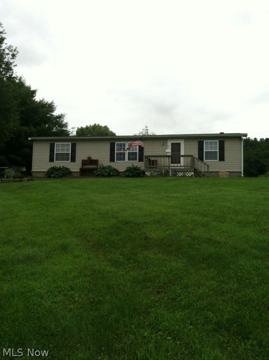 This property is a park like setting. 5 acres flat to slightly rolling, nicely landscaped well groomed. There is a nice detached/barn/storage building.  Nice decks to enjoy the beautiful out doors.2 sources of heat, Electric heat pump, but also a propane gas stove. Electric bill average is approximately $160 per month along with 1 tank of propane per year. Master bedroom with full master bath off the laundry room. 2 additional bedrooms with full bath. Newer carpet in each room. The living room, dinning room and kitchen is an open floor plan with newer laminate flooring. Just replaced holding tank and pump in well with new line.  Property is in move in condition, excellent property, priced to sell!! Conveniently located to Coshocton, Newark, Zanesville. Tri-Valley bus will pickup in front of home. Call today this property won't last long...Come BUY ME!!!!!!!