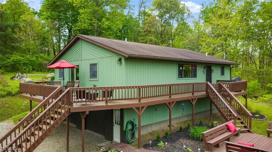 Nestled on 2.25 serene acres, this spacious three-bedroom ranch offers exceptional privacy just minutes from Salt Fork State Park offering flexibility as a private home, weekend getaway or profitable Airbnb. The home features a tiered wrap-around deck with direct access from the master bedroom, perfect for enjoying the peaceful surroundings. Inside, the master suite includes a walk-in closet and a well-appointed master bath. The open, eat-in kitchen flows comfortably for everyday living and entertaining. A full walk-out basement with an integrated garage adds valuable storage and functional space. Beautiful landscaping surrounds the meticulously maintained home, creating a welcoming setting both inside and out. This property blends natural beauty with everyday convenience, delivering the ideal retreat for anyone seeking space, serenity, and standout features.