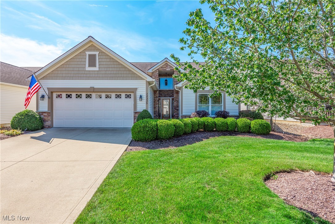 Step into timeless elegance in this thoughtfully designed ranch home, where upscale finishes and smart design combine for effortless living. All on one level, the home offers an open floor plan w/volume ceilings and sun-filled rooms that feel both welcoming and refined.From the leaded glass front door you’re greeted by a dramatic two-story foyer. The great room highlights a vaulted ceiling, gas fireplace and tall windows that fill the space with light while allowing flexible furniture placement. The kitchen is equally impressive with raised-panel cabinetry, granite counters, stainless steel appliances, double ovens, cooktop, French door refrigerator, under-cabinet lighting, and a breakfast bar that opens to a spacious dining area. Sliding doors lead to the screened porch with Trex framing, vinyl-sided walls and ceiling and Miracle Stone flooring. Step out to a stamped concrete patio with built-in gas grill. The backyard feels private with mature pines creating a natural buffer. Landscape uplighting casts a romantic glow across the trees.The primary suite features a volume ceiling, custom shades, and space for a king sized bedroom set. The primary bath offers solid-surface Corian with double sinks, a seated vanity, large step-in shower with glass doors, plus access to a generous walk-in closet. Two additional bedrooms complete the plan—one with a double-door closet and the other designed as a true bedroom with a walk-in closet yet offering versatility as a home office.The garage includes a protective floor coating backed by a transferable warranty, built-in cabinets, pull-down stairs to attic storage, plus mounted hose reel with hot and cold water and drain. A separate enclosed space was added for the furnace and hot water tank, keeping the garage neat and organized.Additional highlights include first-floor laundry with luxury vinyl plank flooring closet and utility tub. Professionally maintained landscaping and snow removal for a low-maintenance lifestyle.