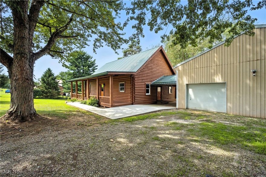 Discover your dream retreat featuring a beautifully updated 1821 sq ft log home, plus a huge garage and a 1 bedroom apartment, all  situated on 5 serene acres at 57218 Somerton, Barnesville, OH.  Inside you will find an updated kitchen with quartz counters, new appliances, expanded kitchen cabinets, and a beautiful breakfast bar. An updated bath with a walk-in shower, new vanity, and soaking tub will be for your pleasure.. New LVT flooring  spans the entire first floor, complemented by a newly cedar-lined closet in the first-floor bedroom and plush new carpet in the cozy loft. The home's exterior has been meticulously cared for with a re-stained and resealed log finish, a new porch roof, and a newer main log home metal roof, all enhanced by new concrete walks and fresh landscaping. Beyond the main residence, a massive garage offers ample space, including room for a motorhome, and features a newly built, fully equipped one-bedroom apartment with, a kitchen,  a full bath, utility room, on-demand hot water, new split system HVAC, private patio, and LVT flooring, accessible from both the garage and its own exterior entrance, making this property ideal for a potential business venture or rental income, with updated electrical systems in both the home and garage ensuring modern convenience. Schedule your private showing today!