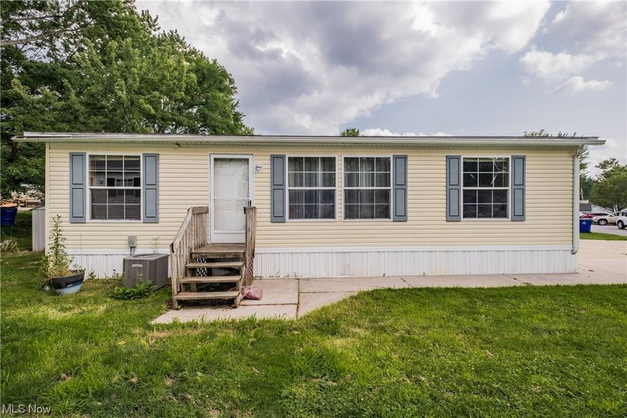 Wonderful, smart alternative to renting. Spacious and beautiful 3 bedroom 2 bath manufactured home. Peaceful country location is close to highways and shopping. Tons of natural light. New flooring throughout including wood laminate in living and dining rooms; stylish vinyl in kitchen and baths and laundry. New paint throughout most of the house. Primary bath ensuite has a garden tub. Central AC installed in 2020. Newer shed. Concrete drive and sidewalk. Lot rental application must be approved.