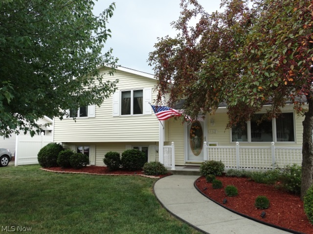 This amazingly well kept home will be the best one you view today! Here at 462 Waterbury Dr. in Eastlake we have a truly move in ready home sweet home. This split level in Surfside has 3 bedrooms with hard wood floors with a vaulted living room and kitchen area that is opened to the dining room. Do not miss the lower level family room that is huge and features a gas fireplace. Take a good look at the top of the line newer Anderson windows! The roof, furnace, hot water tank, and vinyl siding were all replaced in the last 10 years. Relax on the front porch or sit on the back patio that over looks the beautiful back yard that is fully fenced in with maintenance free vinyl fence. The detached 2.5 car garage has plenty of space with full power including a 220 line. Call today for your private showing. You will be happy you did.