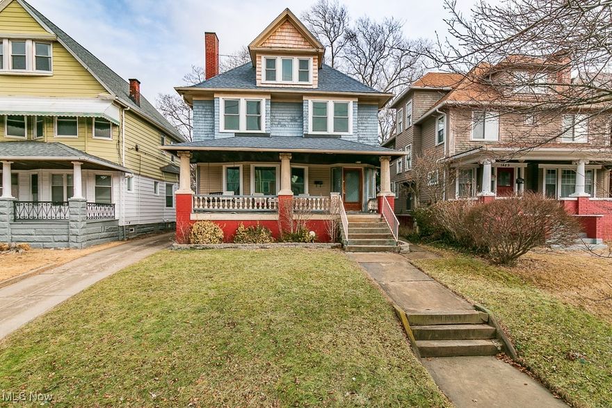 This century colonial, nestled in the heart of Wade Park, offers a charming slice of history! Inside, you'll immediately notice the original character, from graceful pillars and rich beamed ceilings to gleaming hardwood floors and beautiful built-ins that showcase timeless craftsmanship. Just blocks from Fairfax Market, the Cultural Gardens, Botanical Gardens, Case Western, and the Cleveland Clinic and UH campuses, this home combines charm with unbeatable convenience.

Families and those who love to entertain will appreciate the spacious rooms, including a living room with a fireplace surrounded by vintage tile, a dining room with a cozy window seat and display cabinets, and a kitchen with modern stainless steel appliances. A dedicated home office adds to the appeal. A dual sided staircase leads upstairs, where you'll find four generous bedrooms (one with access to a balcony) and a full bath. The finished attic provides a master retreat with a private full bath, clawfoot tub, and a separate sitting room that could serve as a nursery or reading nook.

The full basement offers ample storage, a laundry area, and the potential for a rec room or home gym. Outside, enjoy an inviting front porch, spacious back deck, and a two car garage. With an attractive price and plenty of opportunities to add your personal touch, this home is one you won’t want to miss!