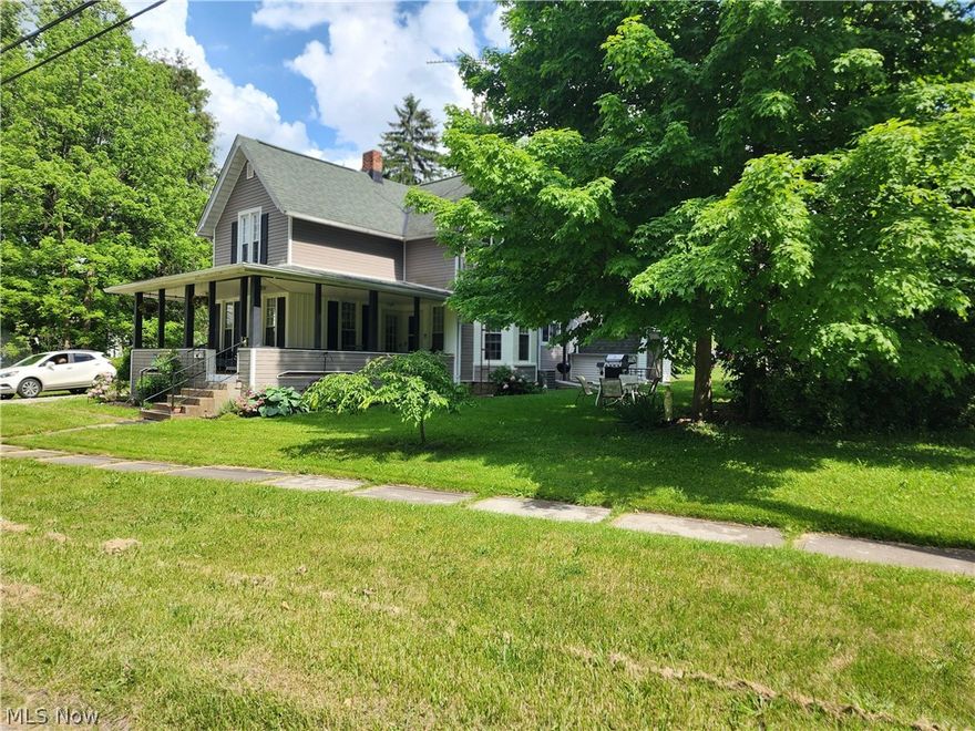 This unique and updated Century Home has 3 bedrooms, 2 Full Bathrooms on .16 acres in Garrettsville Village.  Wonderful Covered Porch welcomes you the Open Concept Dining Room, Living Room and Kitchen with newer American Woodmark cabinets, high end laminate countertops, vinyl tile backsplash, luxury vinyl plank flooring, all stainless steel appliances will stay.  Laundry Room is conveniently located in the first level bathroom.  The second level bathroom was remodeled in 2018.  All rooms and ceilings have been painted as well as newer electrical, plumbing, fixtures, outlets, switches in the last 7 years and furnace, A/C, roof and most windows have been replaced in the last 10-15 years.  There is an Outbuilding/Storage Shed for outdoor needs and a wonderful yard area to enjoy the nicely treed lot. Public Water/Sewer.  A must see in the James A Garfield LSD.