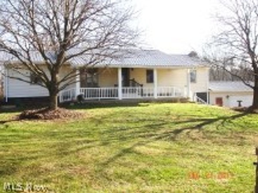 Total interior makeover. New drywall walls, exterior siding, floors sub-floors, and new drywall ceilings, and a new 5-12 pitch metal roof including trusses. This home has a steel frame from a manufactured home and sits on a full basement. The frame is about all that was retained during the complete makeover of this home. Modern new interior to say the least. Front door opens into the Great Room. Custom Quartz counter tops in kitchen and on the island. All new appliances including dishwasher, Stainless 2 door refrigerator, and a new Microwave over the new Range. Breakfast area is near the New French Doors that lead to the large deck. 2 car attached garage, large level parking area. This home sits on Bridge Road just off State Route 541. It is 5.9 miles from Interstate 77 Exit 54. Included are the washer and dryer. Both full baths are all new. New ceilings also in the basement. The basement is mostly finished. Concrete front porch. You must see this home to appreciate all the newness jus