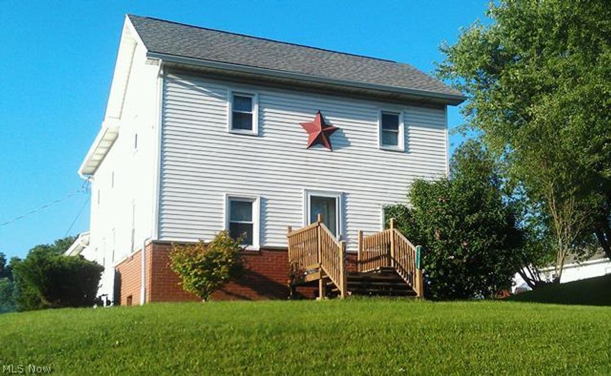 Take a look at this charming and spacious home in the quaint Village of Mt. Eaton and unlock its potential! Built in 1914, the front (original portion) of the house is constructed of hand-hewn logs (behind the siding, can be seen in basement level) and holds nearly a century of history within the walls. 5 bedroom home with 3 bedrooms UP and 2 bedrooms on Main Level! Many updates have been completed in the last 10 years including a beautifully renovated kitchen and flooring, windows '04, shingles on upper roof '03, lower roof shingles '11, furnace '04, and AC unit '05. 200amp '01. A former 2-car garage in the lower level has been converted to useable space within the home by adding French doors, this area could be converted back to garage area by replacing with an overhead garage door. You must see this to appreciate it! This property is in a great location in an adorable village on the edge of Wayne County!  Over 2000 square feet of living space!!