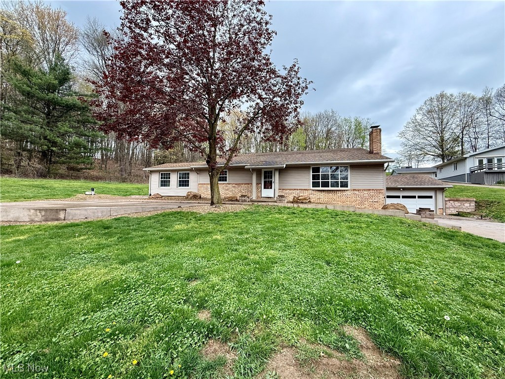 Beautifully Crafted Split-Level Home in Lake Mohawk! Come see this solid, well-maintained, and thoughtfully
updated 3-bedroom, 2-bath split-level brick home, nestled in the sought-after private Lake Mohawk community. Step into
a welcoming foyer that opens to a stunning living room featuring open-rafter style ceilings, a custom brick fireplace, and a
large bay window that fills the space with natural light. The newly remodeled kitchen is a showstopper, boasting custom
cabinetry and sleek concrete countertops—perfect for any home chef. Seller is having all new heating and cooling wall units installed! Just off the kitchen, enjoy year-round comfort in the cozy sunroom with a pellet stove. Up the beautifully refinished hardwood staircase, you’ll find three spacious bedrooms with large closets, gorgeous hardwood doors, and an updated full bathroom with a tub/shower combo. The owner's bedroom includes convenient direct access to the bathroom. The lower level offers even more flexibility with a finished bonus room—ideal as a fourth bedroom or home office—complete with a closet. A second full bath with a stand-up shower, laundry area, and an additional family or media room provide ample space for relaxation or entertaining. Additional
features include a 2-car attached garage, a large, beautifully landscaped yard, and a brand-new stamped concrete front pad—an ideal spot for gatherings and enjoying the outdoors. Located in Lake Mohawk, a gated 500+ acre private lake community with unlimited horsepower boating, two beaches, a 9-hole golf course, clubhouse, tennis and pickleball courts, and a vibrant calendar of clubs and community events. This is more than just a home—it’s a lifestyle.