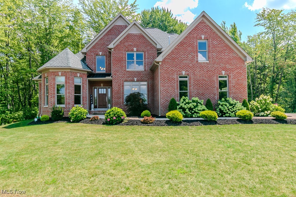 Welcome to this breath taking home located in Chardon Township. As you enter the long concrete drive you will be greeted with a large, landscaped pond and firepit for those star-gazing nights. As you enter this brick front home and custom front door, you walk into cathedral living area. Master bedroom on the left with custom ceiling and large welcoming windows. Walking into master bath you will pass two separate walk-in closets. Two sinks and vanities across from each other with a soaking tub, separate glass and tile shower. The toilet with a bidet in the water closet. If you take a right from foyer, you will enter the dining area. If you go straight, you can walk up the wooden stairs to the second floor or enter the inviting family area with gas fireplace. The kitchen has a breakfast bar and an eat in kitchen area or you can enjoy the brand new Trex deck (2025) overlooking the wooded back yard. Granite counters, stainless appliances, soft close drawers, closet pantry, wide cabinets and ample drawers for storage. Down the hall you will arrive at more closet storage, laundry room with sink and cabinets. There is a bedroom with an attached bath that can also be accessed from the hall. This could double as a private office. Upstairs you will find 2 more bedrooms and a jack and jill full bathroom. Over the garage is a bonus room/bedroom with access to ample storage with insulated doors. The downstairs features a bar with a mini fridge and pool /ping pong table. There is also an egress window for safety. This home also has custom wood blinds, floating premium floor, Kinetico system. Make your appointment today to see this elegant home. Blueprints are available.