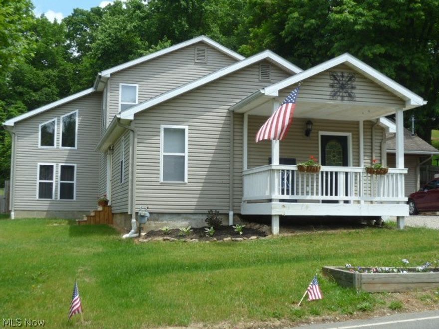 This spacious vinyl sided 4 bedroom home with a large back yard (.72 acres) is great for a growing family.  Located close to town just outside of the city limits with city water & sewer.  The kitchen, living room, & upper level addition was added in 2002 making the square footage of this home 2464 square feet! This home features a laundry and a half bath on the first floor level.  The home has matching bronzed rubbed hardware & light fixtures throughout.  A new gas furnace was installed in 2015 & a new garage door in May of 2016. French doors are featured in the lower level dining room and the second floor hallway.  Imagine yourself stepping through your french doors and out onto your second level deck to enjoy your morning coffee! All new window treatments and newly installed 200 amp service with all electric updated in the home.  This home is a must see!
This home is located in the River View School District, but within one mile of Coshocton City Schools.