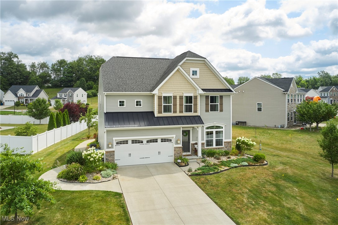 OPEN HOUSE July 27 1-3pm!!! Tucked away in the scenic Lakes of Green community, this beautifully updated home at 2747 Compass Point Drive offers the perfect blend of comfort, convenience, and charm in the highly rated Green Local School District. Enjoy tranquil pond views and access to private stocked fishing ponds, all while being just minutes from many amenities including: shopping, restaurants, state parks trails, golfing, boating and excellent highway access. Inside, you’ll find a thoughtfully designed layout that makes everyday living easy. The main floor features a cozy front area perfect for an office or a peaceful reading nook, a convenient half bath, and a spacious Great Room with new flooring (2023). The upgraded eat-in kitchen flows seamlessly into a bright Morning Room, where sliding glass doors open to a concrete patio added in 2020—ideal for outdoor entertaining. A functional mudroom connects the kitchen to the attached two-car garage, offering everyday practicality. Upstairs, you’ll find four generously sized bedrooms, a full bathroom, and a convenient second-floor laundry room. The primary suite serves as a private retreat, complete with an ensuite bath featuring a garden tub, walk-in shower, and a spacious walk-in closet. Additional updates include new carpet upstairs and on the stairs (2022), a brand-new dishwasher (2025), a newer water heater (2024), and regular HVAC service by Apollo. There is currently monthly yard treatments by Mosquito Authority to add to the home’s low-maintenance lifestyle. With a full unfinished basement ready for your personal touch, this move-in-ready home checks every box. Don’t miss your chance to make it yours!