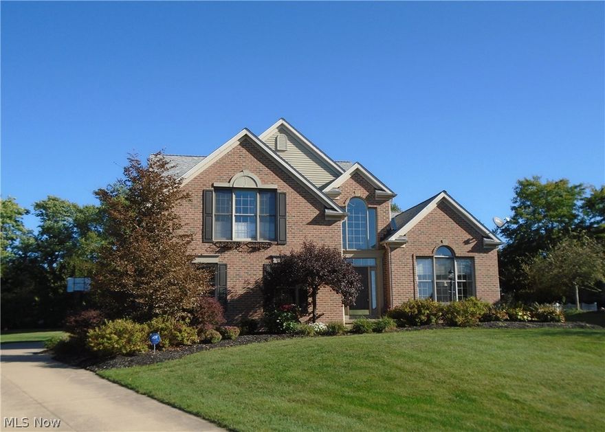 Gorgeous first floor with open floor plan . 2 story great room and kitchen freshly painted. Kitchen with newer granite counter tops, stainless steel appliances and oak floors. Bar area overlooks the great room. The great room has wall gas fireplace with built in projector and screen. Great Room windows has  transoms treatments and over looks the stamped patio. First floor master w trey ceiling. The master bath has newer granite counter top and flooring, along w corner garden tub, separate shower and walk in closet with built ins.  The foyer is also 2 story with wood floors and is freshly painted.The second floor offers 3 additional bedrooms and a built in lofted area. The second bedroom has hardwood floors. There is a first floor library as you enter the home. It has built in cabinets and cherry wood floors.The stamped patio has a wood burning fireplace and a hook up for natural gas for the new owners grill. The backyard offers beautiful views of green space and a pond. Great for relax