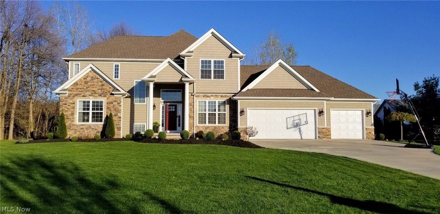 WOW!! This truly is a one of a kind gorgeous home!! Open concept great room and kitchen, and a formal dining room. Plus the Owners suite and bath on the first floor, and the laundry, an office, and a half bath. Then upstairs, the second floor is just as stunning! 3 generous bedrooms, 2 full baths, and a huge additional living space, which could be used as a 5th bedroom. All 5 baths have granite counters. So many light fixtures have been updated. This home was new 5 years ago, and now its better than new. In the basement there is 1200 more square feet, which includes an unbelievable media room with a complete theater that is staying with the house. It has theater seating, and even a candy counter or wet bar complete with 2 wine or beverage coolers, surround sound speakers, and a Sony projector. There is also a full bath with a marble shower, and still much room for storage. All appliances are staying, except the freezer in the garage,  and the theater. There are also a full row of cabin