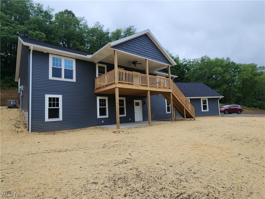 It's back on the market.  The grading is done, topsoil has been spread, and the yard is seeded.  This exquisite new home with a breathtaking view and peaceful country setting.  Imagine enjoying your morning coffee on the raised front deck watching the sunrise.  This gorgeous 3 bedroom 3 bathroom home features a spacious open concept with a front deck/balcony off the living room, quality Dutchman cabinets and island in the kitchen, and a 4th bedroom in the basement.  This quality raised Ranch built by Lawver Builders has it all: master bedroom and bath with a walk-in closet, first floor laundry, 3 acres, and 2nd detached garage.  The 13-course basement has a 30-year dry guarantee, a finished bedroom/den and full bathroom, the remaining (over 33 x 34) area is ready to finish. The walkout door opens to a concrete patio with a beautiful view.  A great location near Zoar Golf Course, about a mile to the Ohio and Erie Canal Towpath and Zoar Village. All the benefits of building a new home wi