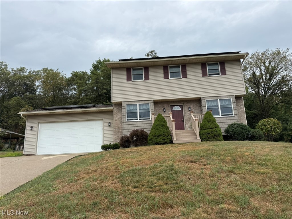 Well maintained 3-4 bedroom, 2.5 bath vinyl sided home. Brick gas fireplace in the family room with sliding glass doors to the 16 X 12 rear deck. Abundant cabinet space in the new grey kitchen featuring granite counters, subway tile backsplash, and breakfast bar. Remodeled main floor half bath with ceramic tile floors. Master bedroom includes a walk in closet and full bath with 5' walk in shower. 2 additional bedrooms on the second floor with double sinks in the Jack & Jill bath Large rec room in the lower level with office/4th bedroom. Anderson windows throughout. 2 car attached garage. 200 amp electric. Updated gas furnace in 2019 and central air in 2018. Scenic tree line provides privacy in the backyard. Excellent south side location on a private, cul-de-sac street. Current owner's utilities average $84 for gas, $80 for electric and $68 for water & sewer monthly. Rented hot water heater $19.11 per month. Utilities are low thanks to solar panels which are leased monthly for $149.70.