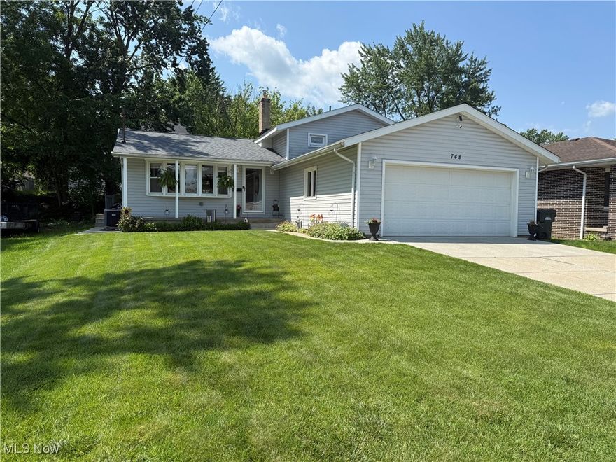 Lovingly cared for 4 level split is a must see!  Welcoming front porch leads to the vaulted beamed living room full of natural light from the bay window.  Open & airy floorplan is perfect for family & friends gathering & entertaining.  Formal dining room is adjacent the kitchen with plenty of cabinetry, peninsula island, granite counters, & SS appliances.  Lower level family room is great for watching your favorite TV shows & allows access to the fenced luscious landscaped backyard & patio, which also holds a storage shed.  Lower level also hosts a potential 4th bedroom & full bath with easy access to attached garage.  Upper level holds the 3 bedrooms & 2nd full bath.   Basement boasts yet another huge recreation room area located off the utility & laundry area.  Updates include roof 2025, hot water tank 11/2024, window treatments, added CF in dining & 2 bedrooms.   This home is a true gem and way bigger than it looks from the outside.   Schedule your showing today !