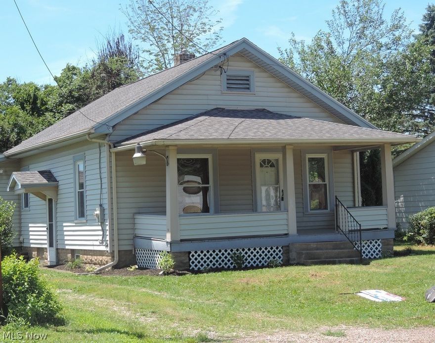 This 3 bedroom home has been recently updated (2016) with new kitchen and stainless appliances, new bathroom, all new flooring and light fixtures, some new dry walling, new 200 amp electric service. Spacious living room with oak hardwood floor could also be a combination dining room/living room. Master bedroom has double closets. The replacement windows provide great natural light throughout the home. Great property for the money. Roof (2010). 60X200 flat lot with a 2-car block garage. MWCD $6.00 yearly.