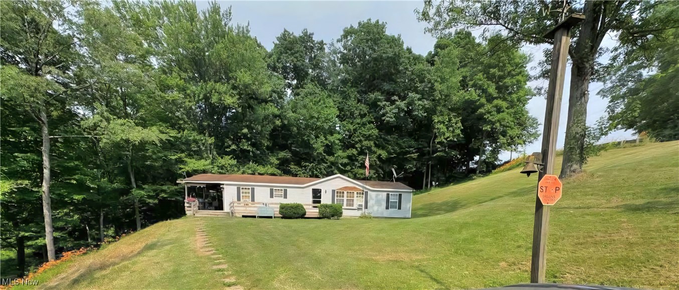 Bring your vision and make this property shine! This 3-bedroom, 2-bath manufactured home on a foundation sits on 6 acres in the sought-after Ridgewood School District. The home has not been lived in for 6+/- months as of the time of listing and will need extensive cleaning, updates, and repairs—but it offers a fantastic opportunity for the right buyer to create a private country retreat. There is a detached building that will convey with the property. Washer, Dryer will convey to the new owner. The acreage provides plenty of room for outdoor activities, gardening, or even adding additional buildings. With some work, this property could be a wonderful full-time residence, rental investment, or weekend getaway. If you’ve been searching for land with potential and are ready to put in some sweat equity, this is your chance. Seller provided photo from when property was occupied. Seller will be working on mowing the property within a few days of listing. Any contents on the property at the day of possession will convey to the new owner. Cash or Conventional Buyers Only please. Contact a licensed real estate agent for a private showing.